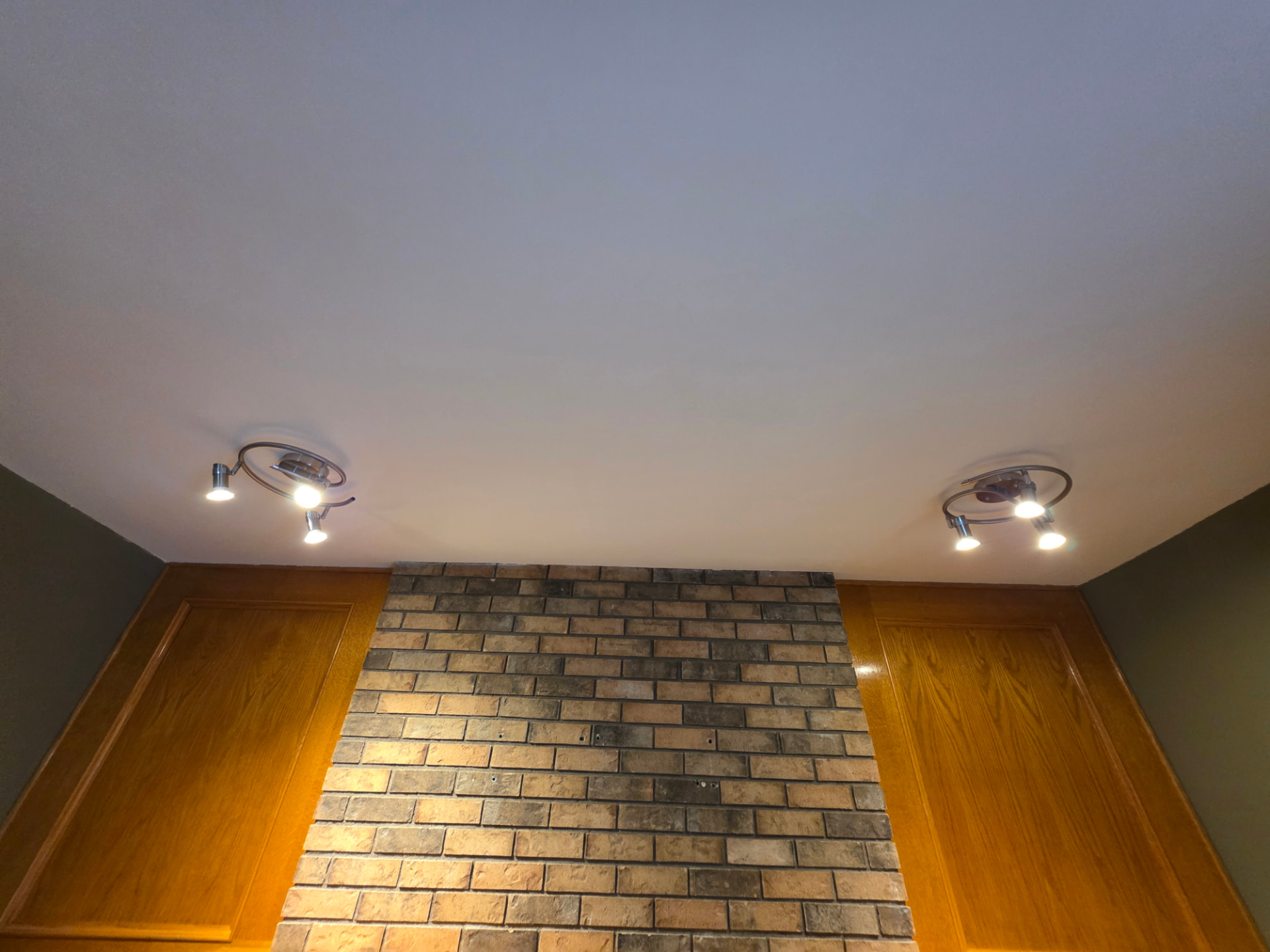 After: close-up of the repaired ceiling area above the fireplace